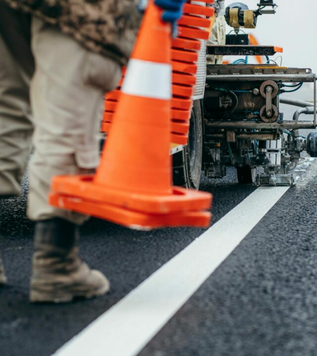 workers-applying-new-road-markings-outside-city